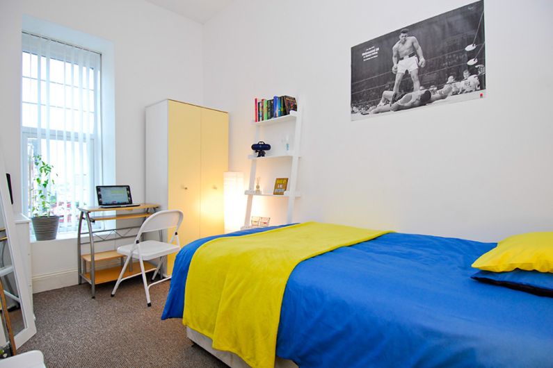 Classic double room having bed and study table