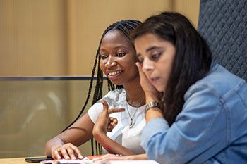 Female students working and studying together