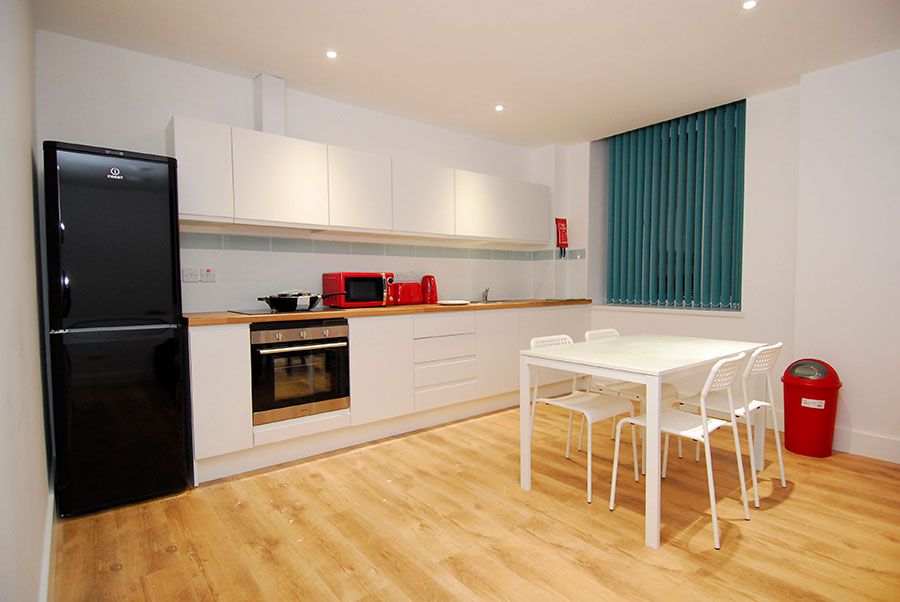 Premium en-suite kitchen having dining table in the kitchen
