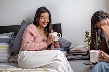 Female student socialising in accommodation