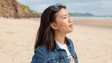 Female student on coastal beach