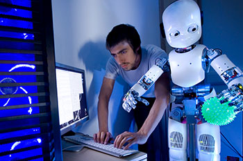 Student programming a robot