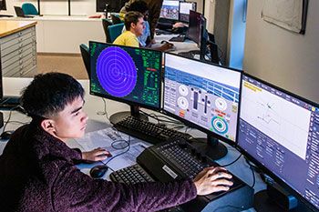 Student programming a simulator