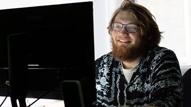 Male student working on computer