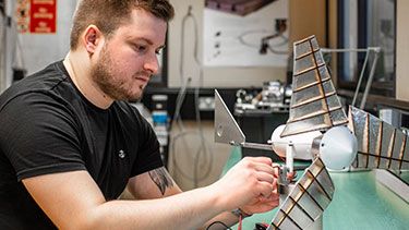 Male student working on engineering project