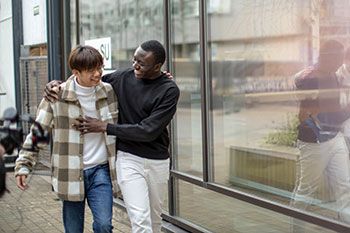 Male students walking together on campus