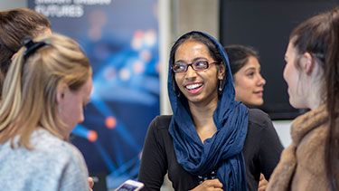 Students talking at event