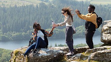 Students outdoors on a mountain view