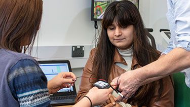 Psychology students using equipment