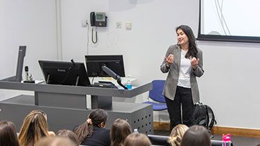 Law students watching a female lecturer